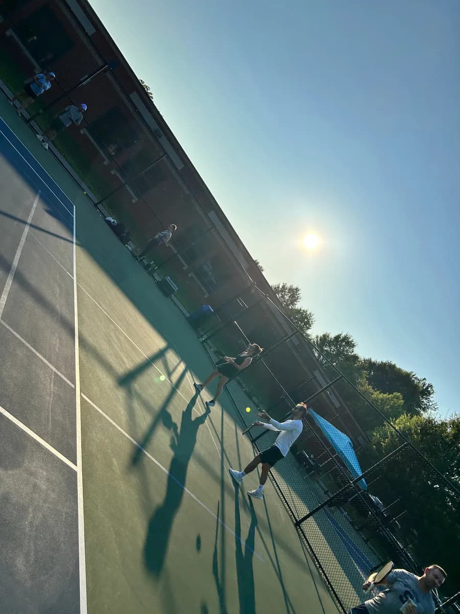 Pickleball players taking part in an outdoor doubles rally