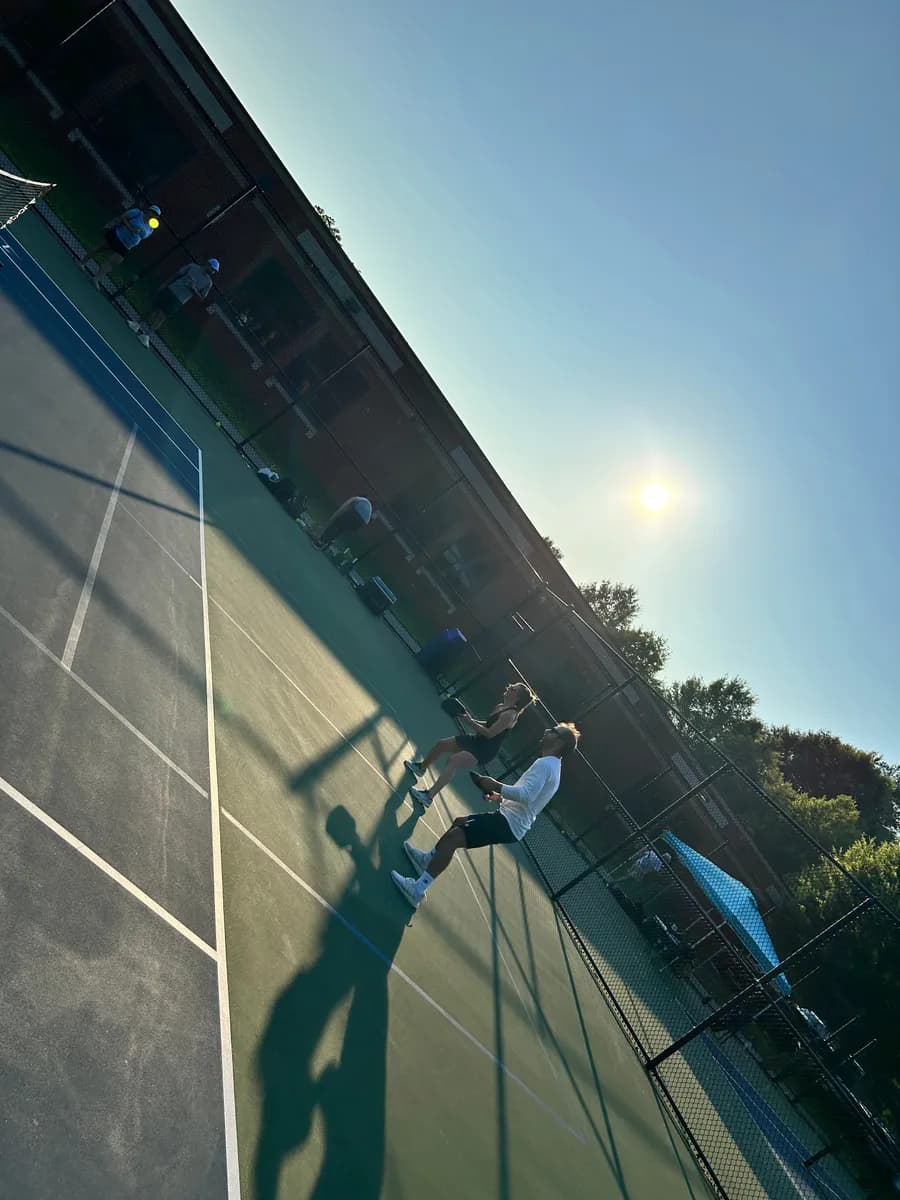 Pickleball players taking part in an outdoor doubles rally