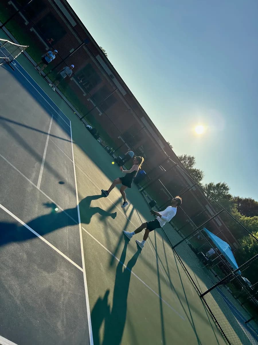 Pickleball players taking part in an outdoor doubles rally
