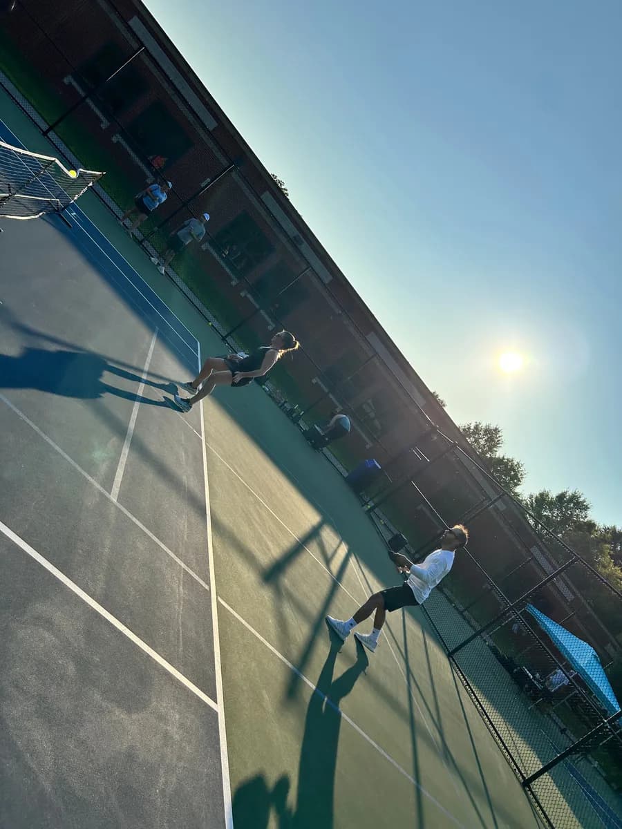 Pickleball players taking part in an outdoor doubles rally